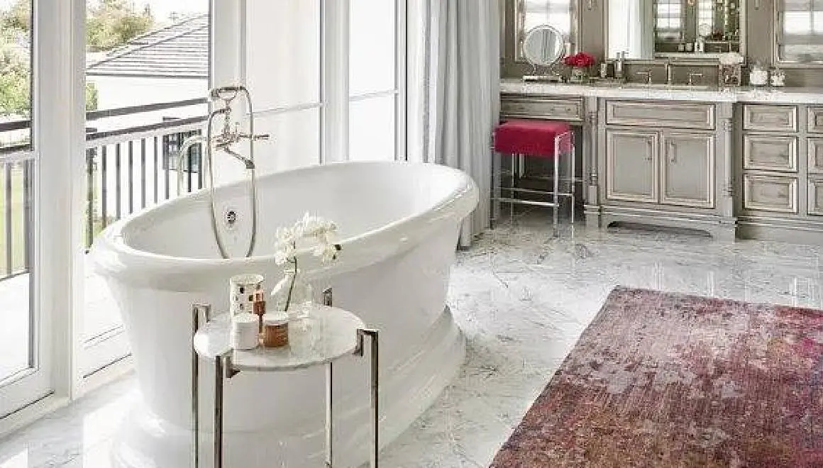 A bathroom with a tub and sink in it