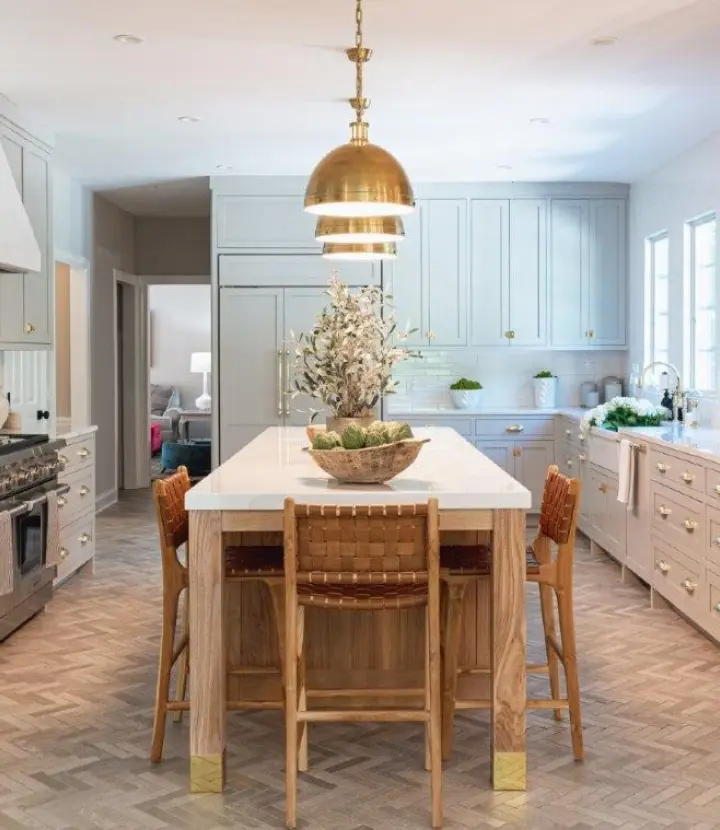 A kitchen with a table and chairs in it