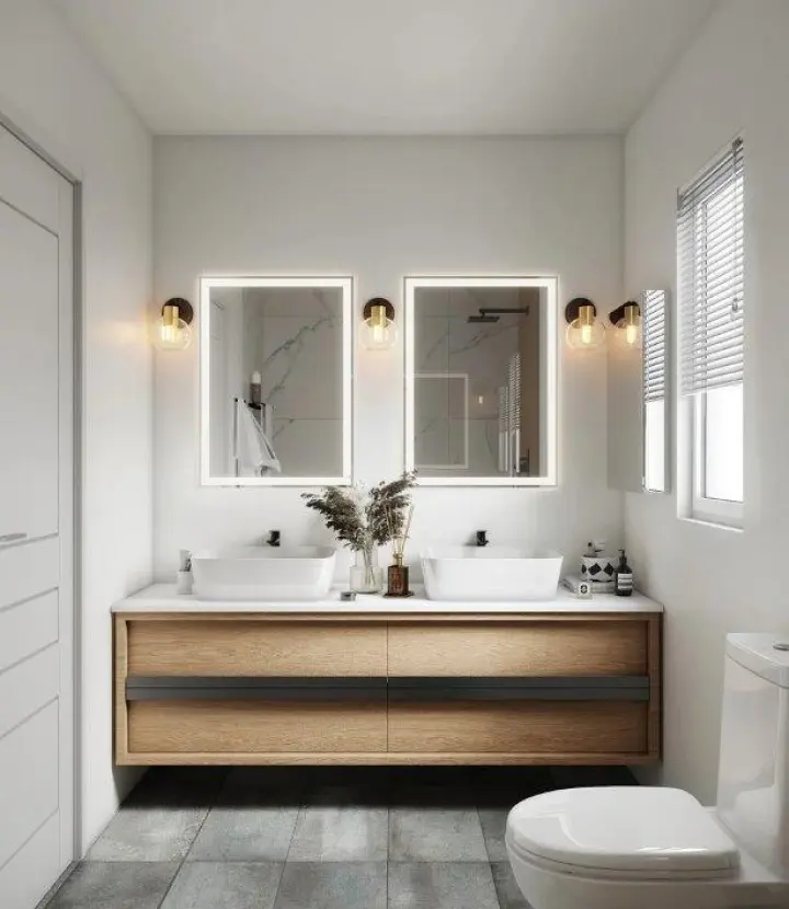 A bathroom with two sinks and mirrors in it