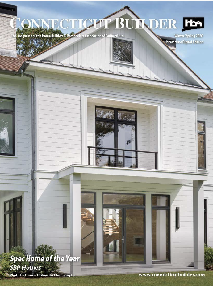 A white house with black shutters and windows.