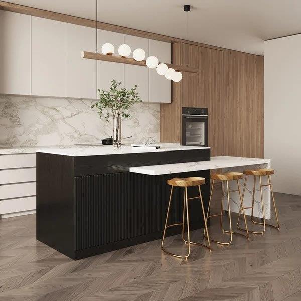 A kitchen with a large island and wooden floors